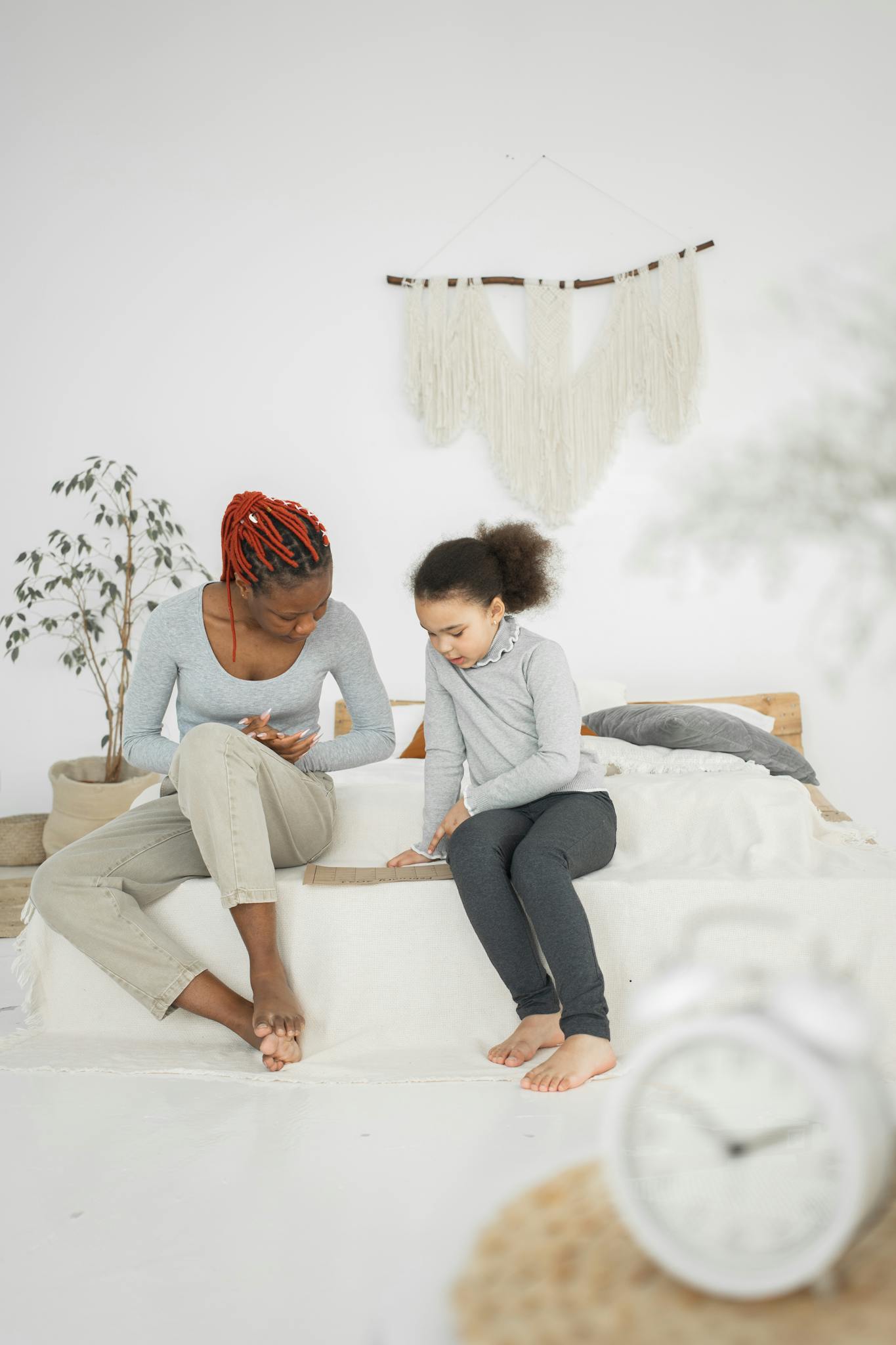 Black woman with child reading book